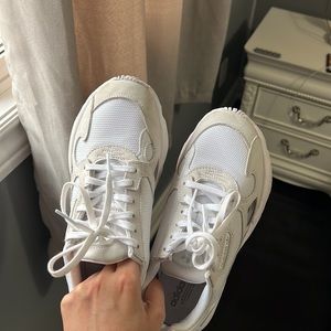 All white Adidas Falcons